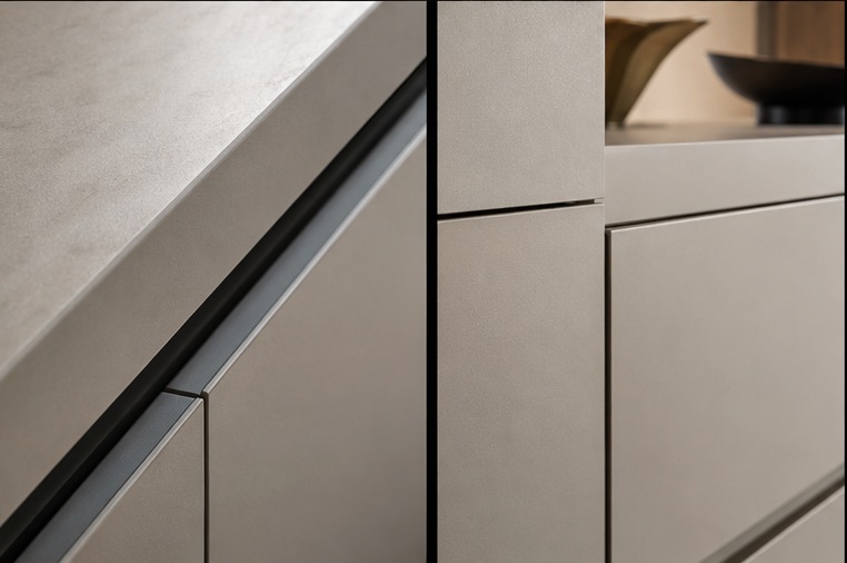 Primrose Hill Stone & Brass Kitchen — Handleless shadow-gap door detail